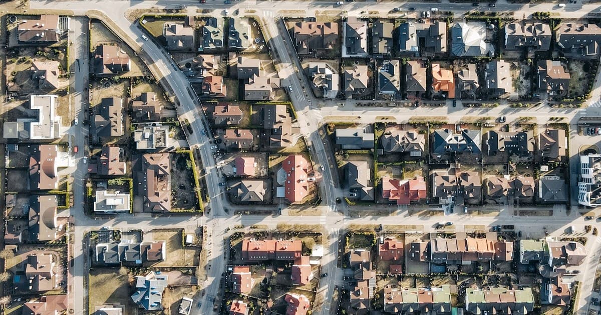 Aerial view of an organized suburban housing layout with a street grid