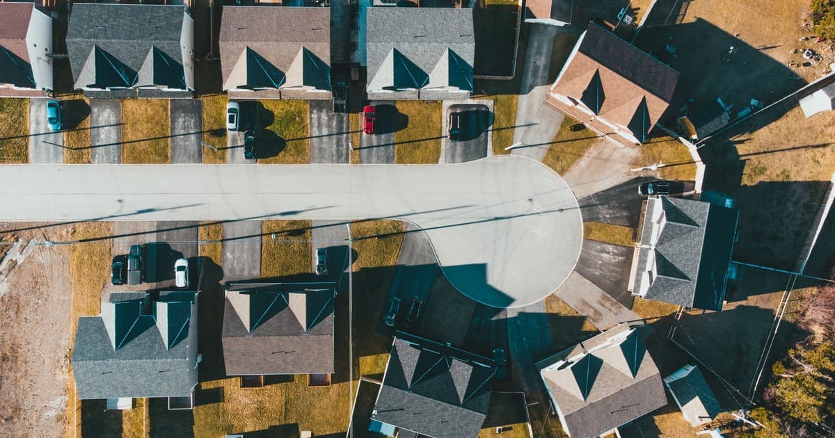 Aerial view of a suburban residential neighborhood with houses and streets