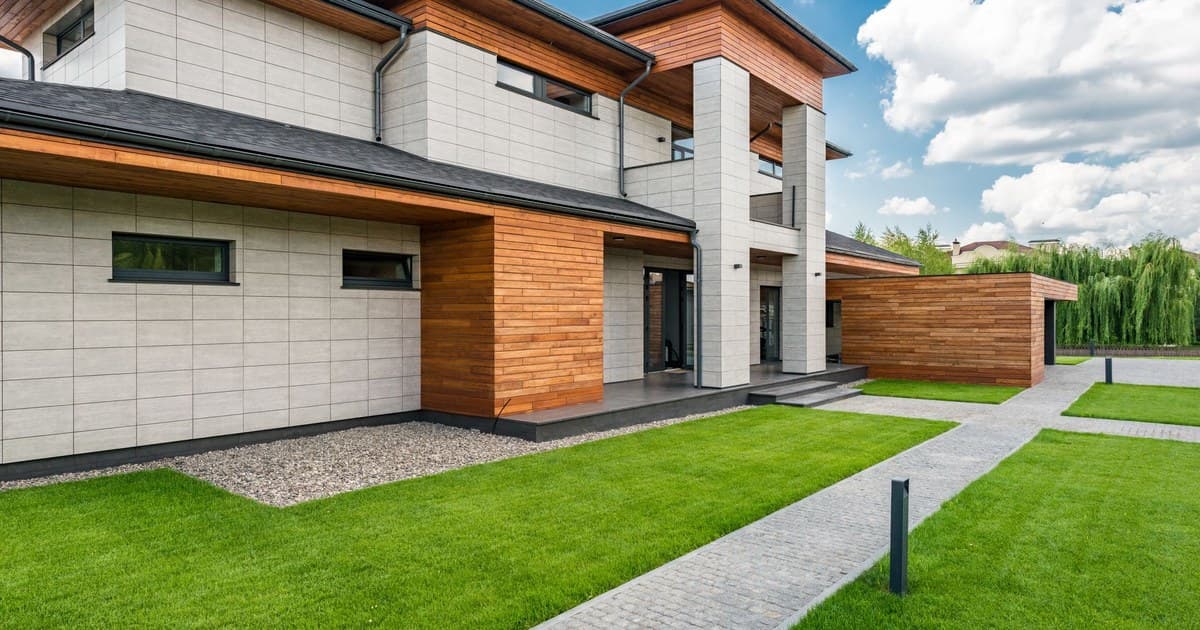 Modern villa courtyard with landscaped lawn in DHA Lahore
