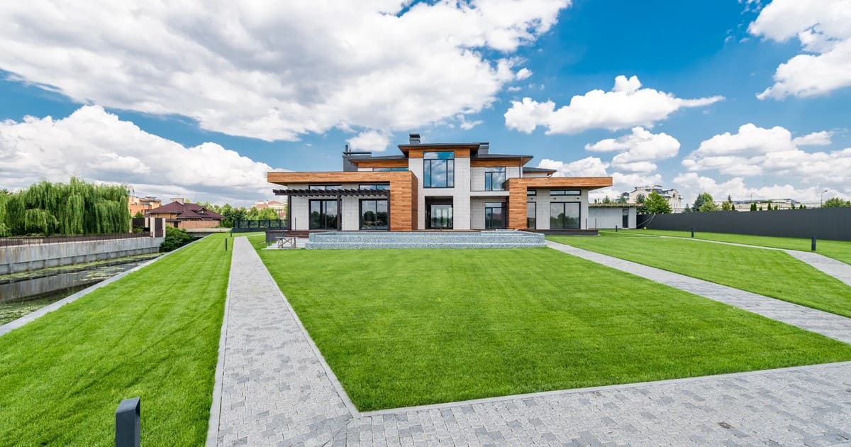 Modern villa with a green lawn, the type of property overseas Pakistanis buy in Lahore