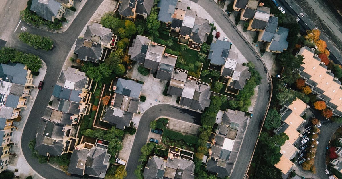 Aerial view of a planned residential neighborhood with streets, houses and greenery
