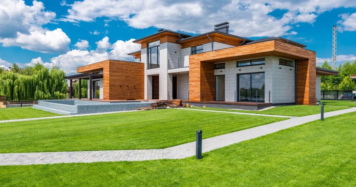 Modern residential villa with landscaped lawn