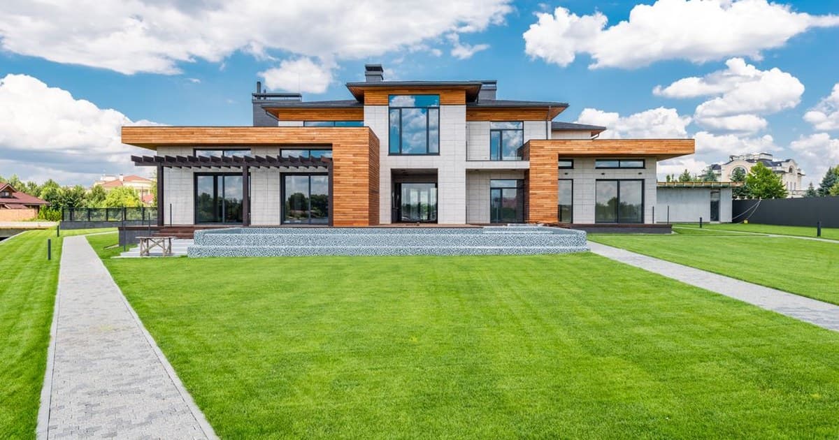 Modern house with a large lawn, typical of developed residential streets in Wapda Town Lahore