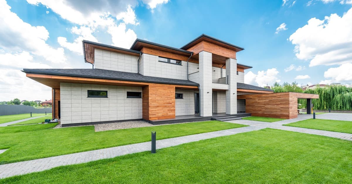Modern house with a spacious lawn, showing the extra space a larger plot provides