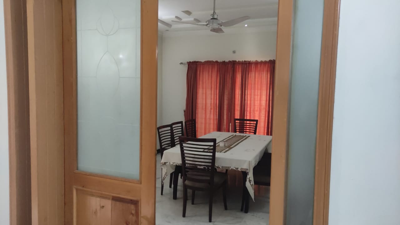 Dining room seen through wooden framed glass doors